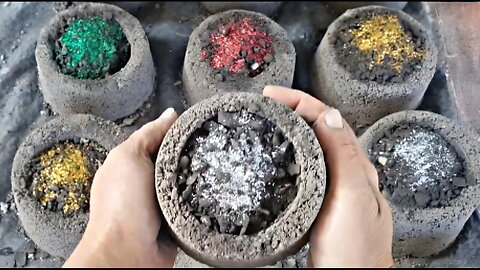 Charcoal bowls filled with glitter crumbling on floor
