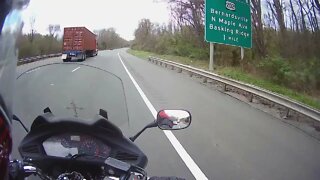 Motorcycle trip from Massachusetts in high wind. Blown off the road. Bad driver clip
