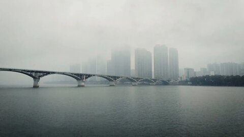 Rainy day in Changsha with a view of the Juzizhou bridge crossing the Xiang Jiang