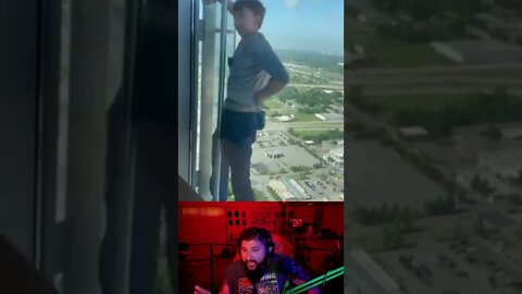 Kid free climbs side of tall building