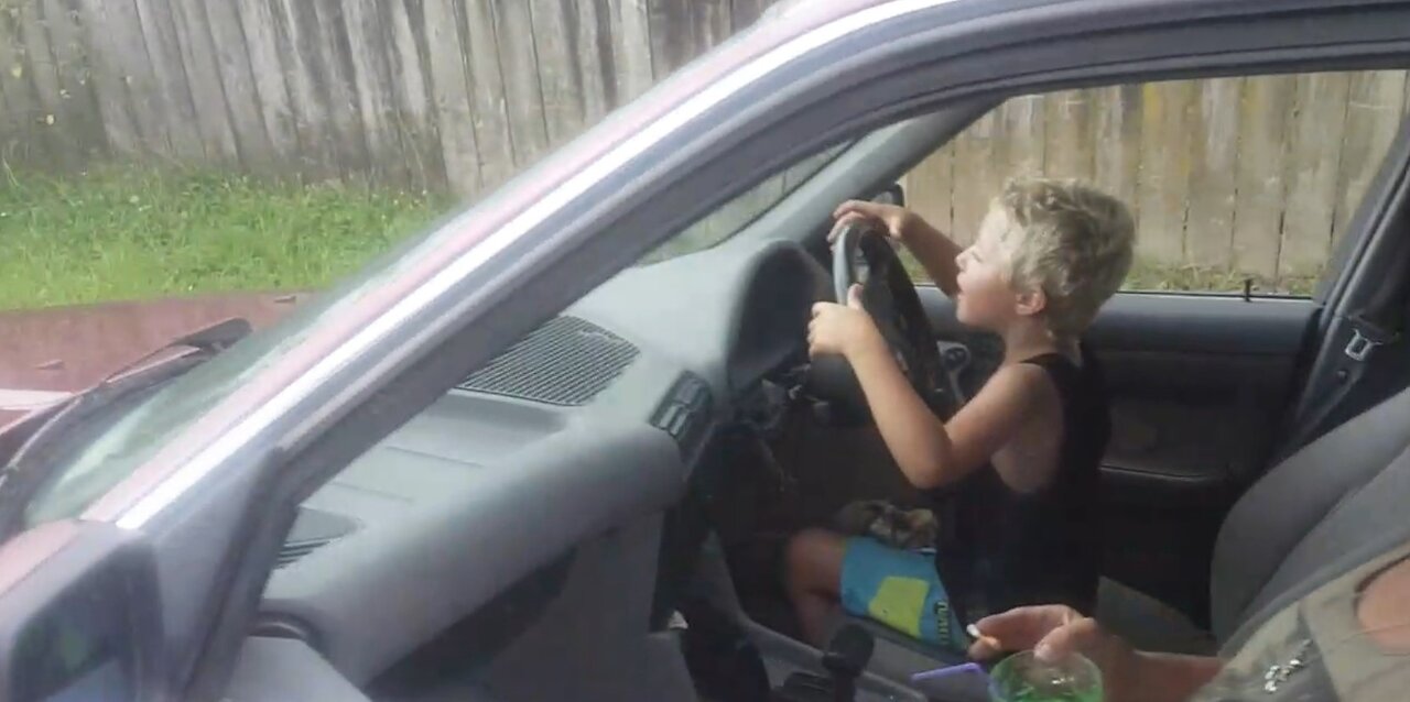 7 Year Old Driving A Bmw By Himself