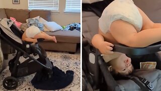 Toddler Watches Cartoons In Hilarious Awkward Position