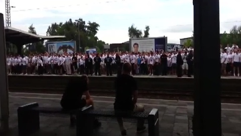 Football fans put on insane show while waiting on train platform