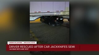Driver rescued after car jackknifes semi
