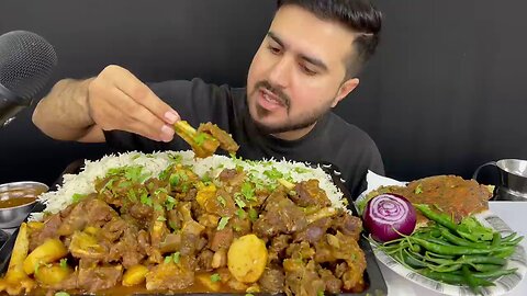 eating patato mutton cury with rice & omelate+greenchilly+onion