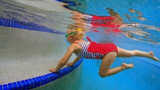 Baby Swimming in Pool