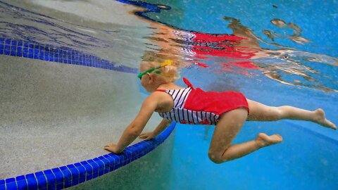 Baby Swimming in Pool