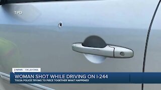 Woman shot while driving on I-244