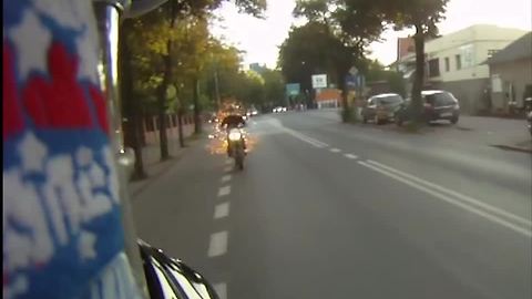 Motorcycle exhaust on fire spits out flames