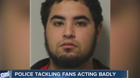 Police tackling fans acting badly