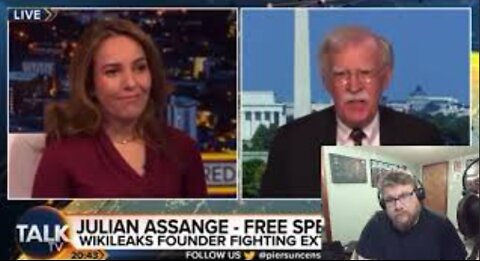 Julian Assange's wife Calls John Bolton a “War Criminal" to his Face