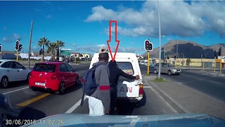 Two Thieves Steal from a Car at Stop Light