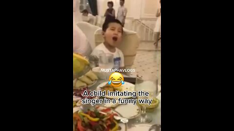 A child imitating the singer in a funny way