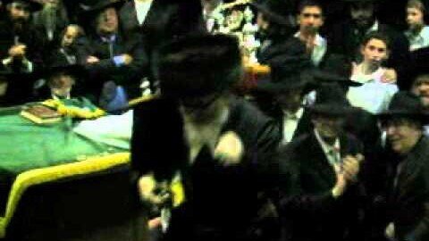 Skverrer Rebbe dancing with a Torah Scroll