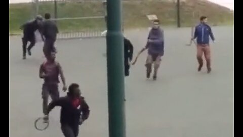 Afghans & Africans trying to murder each other with machetes & sticks at a park in Italy