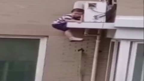 Man catches toddler falling from fifth floor in China #Short #Viral #Trending #Shorts