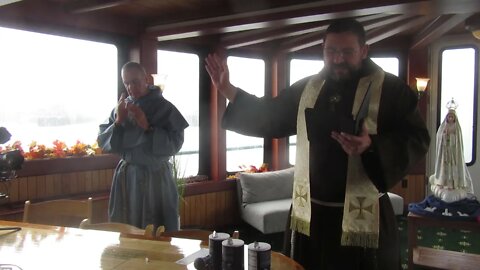 The blessing of the crowd, exorcising of salt & water emptied into Boston Harbor with Fr Leonard