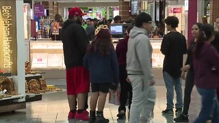 Last-minute shoppers pack the mall two days before Christmas
