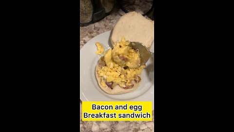 Scramble Egg With Bacon & Cheddar cheese Breakfast Sandwich.