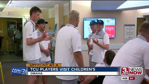 TCU players and coaches meet patients