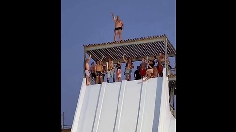 Huge Russian man jumping on the swimming pool