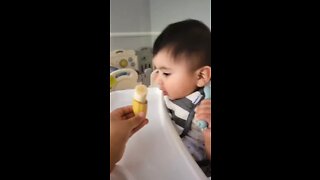 Baby eating a banana