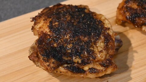 Cooking chicken thighs in cast iron.