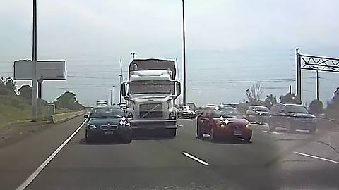 Truck driver swerves to avoid car, hits another vehicle