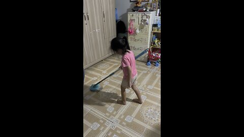 My daughter helps clean the floor