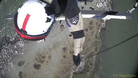 A drowning swimmer is rescued by being hoisted to a waiting ambulance at Point Pinole