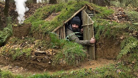 Making a full and cozy survival shelter | Bushcraft earth house, grass roof, and clay fireplace