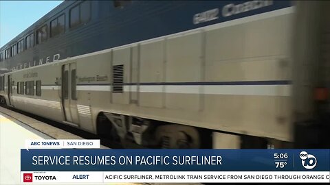 Wale Aliyu speaks with commuters as Pacific Surfliner resumes service