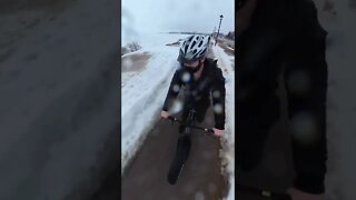 Riding over a puddle on a fat bike