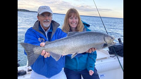 Extreme King Salmon Fishing Lake Ontario, lady does great job landing this King Salmon