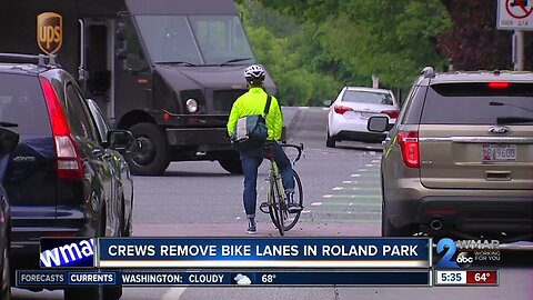 Crews remove bike lanes in Roland Park