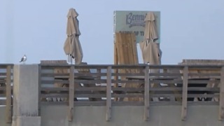 Pier left damaged from rough surf