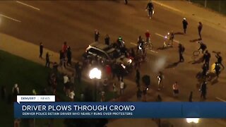 Man detained after driving car through crowd of Breonna Taylor protesters in Denver, police say