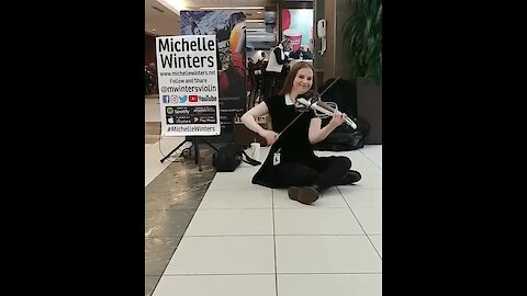 Violin player entertains passengers during flight delay