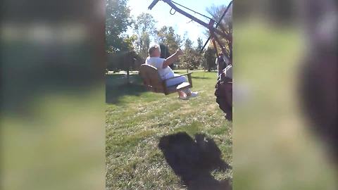 Senior Woman Enjoys A Ride On A Bench Attached To A Tractor