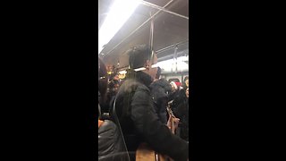 Skytrain transit commuters burst in Christmas caroling