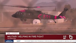Military helping in fire fight