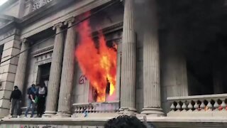 Hundreds of anti-government protesters break into Guatemala's Congress, burn part of the building