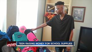 Winter Haven student filling bags with schools supplies for those in need