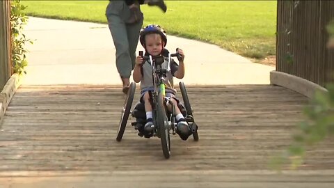 Family friend helps raise money to buy bike for Denver child with physical disabilities