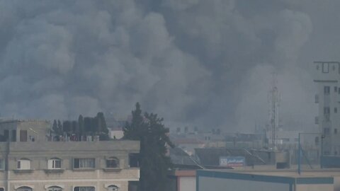 Large cloud of smoke rises over buildings after strike on Gaza's Rafah