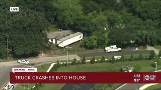 Semi-truck crashes into side of a house in Tampa