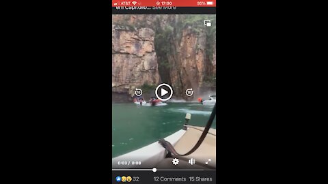 Rock falls on boat and kills people. Warning GRAPHIC.