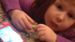 Little Girl Tries to Put Money in a Cell Phone