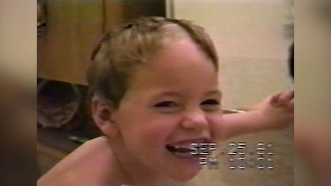 A Tot Boy Laughs At His New Haircut