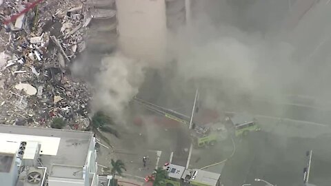 Flames, smoke break out at site of deadly Surfside condo collapse